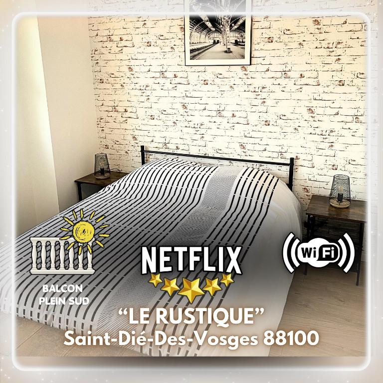 a poster of a bed in a room at Le Rustique Vosgien in Saint Die