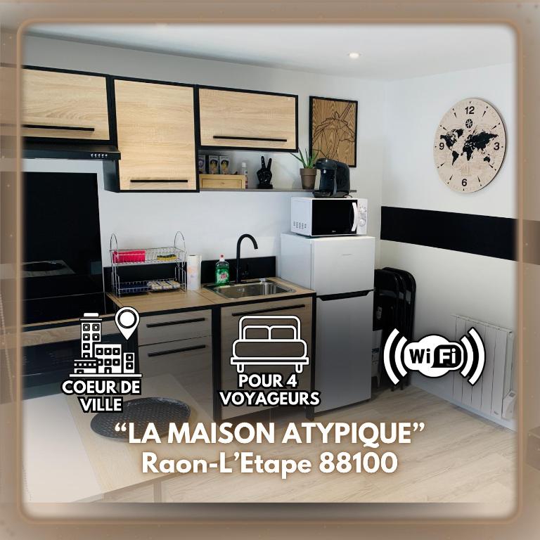 a poster of a kitchen with a kitchenestamp at Petite maison atypique cocooning in Raon-lʼÉtape