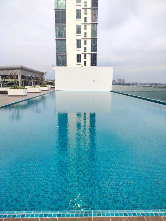 a swimming pool on the roof of a building at Bangi Studio Suite - Netflix in Kampong Sungai Ramal Dalam