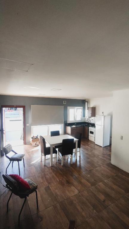 a kitchen and dining room with a table and chairs at rocky in Concordia