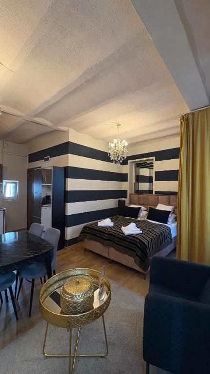 a hotel room with a bed and a table at Ehli Keyf Hotel in Istanbul