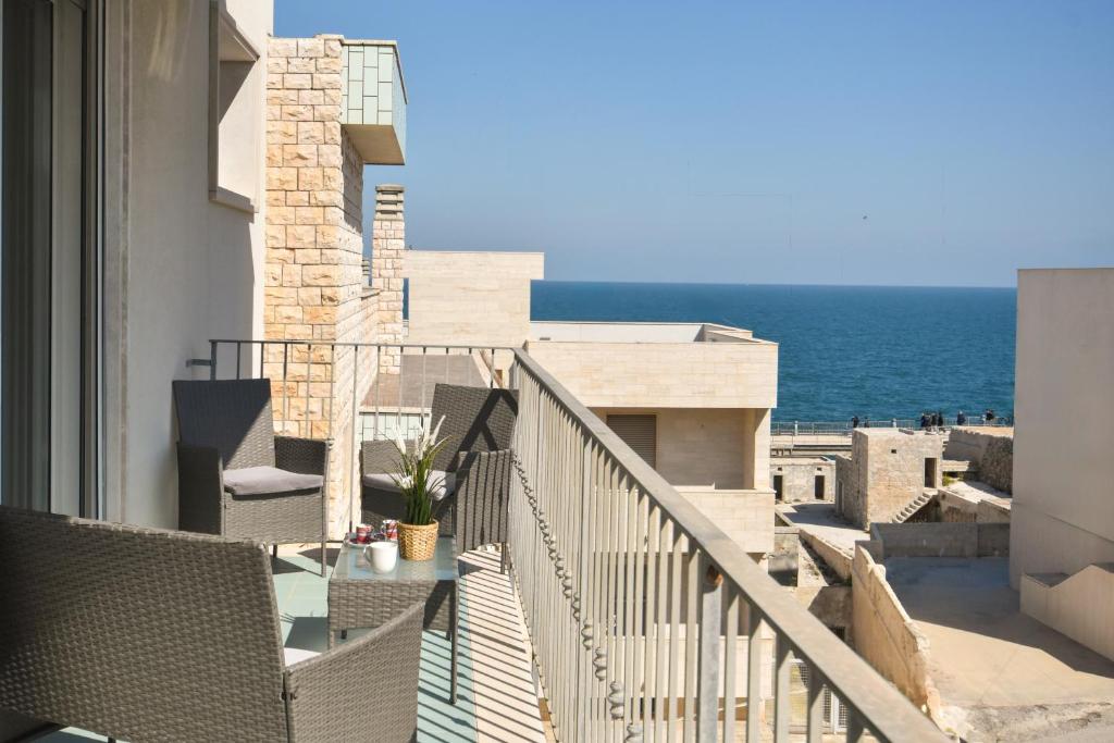 a balcony with a view of the ocean at Levante Sea View Apartment - Housea in Polignano a Mare