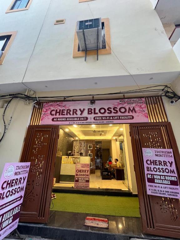 a city blossom storefront with signs on the door at Cherry Blossom in Varanasi