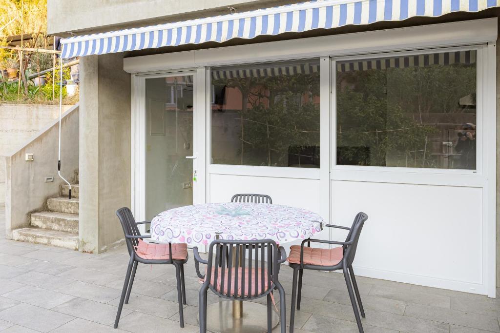 a table and chairs sitting on a patio at Apartments M&M Portorož in Lucija