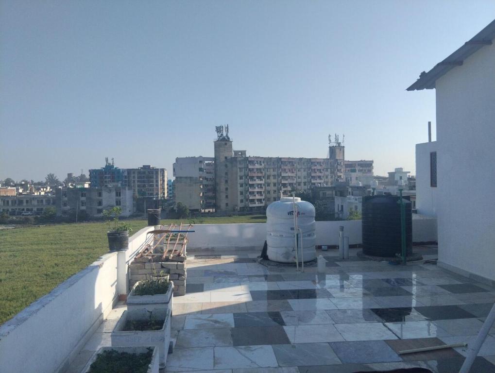 a balcony of a building with a view of a city at Leisure Paradise in Kharar