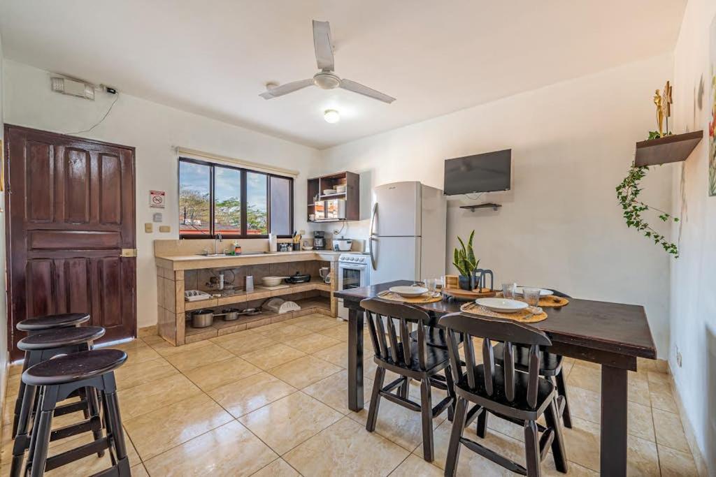 a kitchen and dining room with a table and chairs at Garza 912 in Carpintero