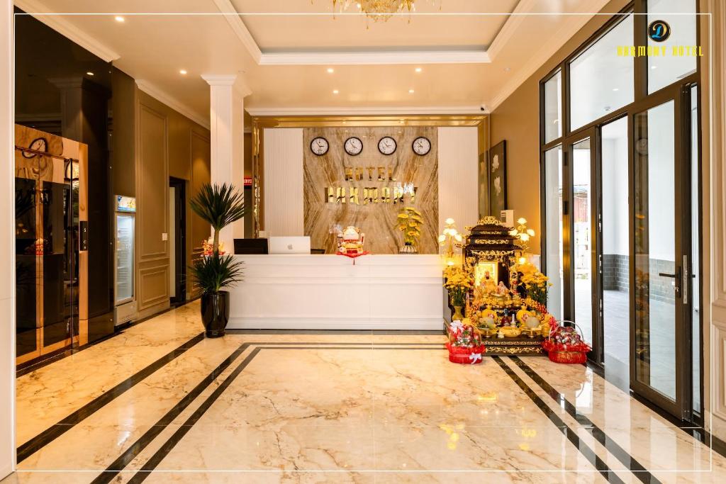 a lobby with a counter in the middle of a building at Harmony Hotel Nam Định in Như Thức