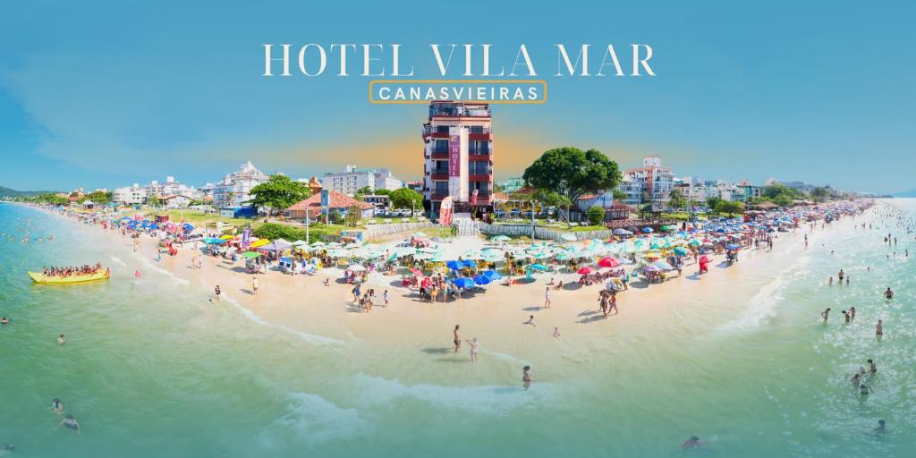a group of people on a beach in the water at Hotel Vila Mar in Florianópolis