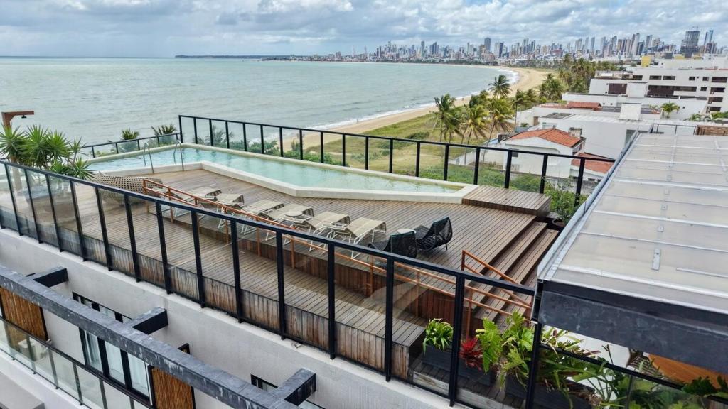 a view of the ocean from the balcony of a building at Restinga 305- Flat vista mar no Bessa - ASKA in João Pessoa