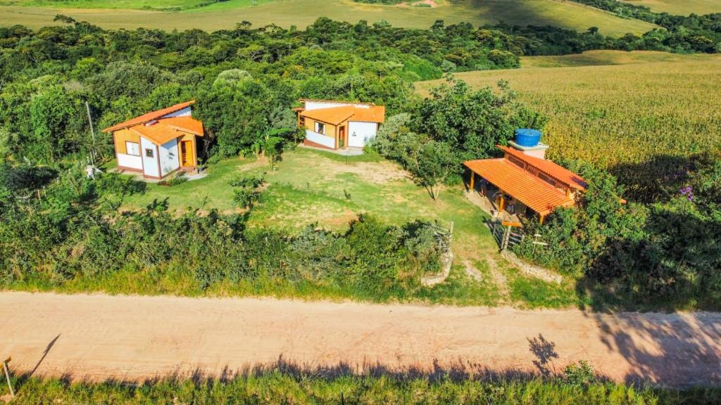 an aerial view of a house in a field at Sítio Embaú in Carrancas