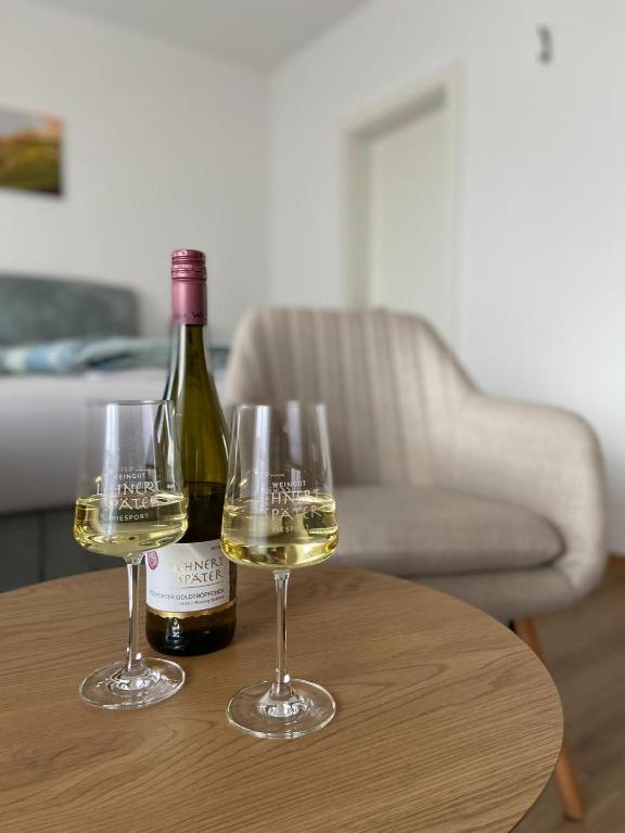 two glasses of white wine sitting on a table at Weingut Lehnert-Später in Piesport