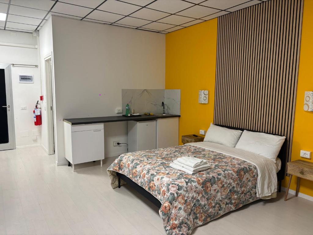 a bedroom with a bed and a desk in it at Loft 80 in Castel Maggiore