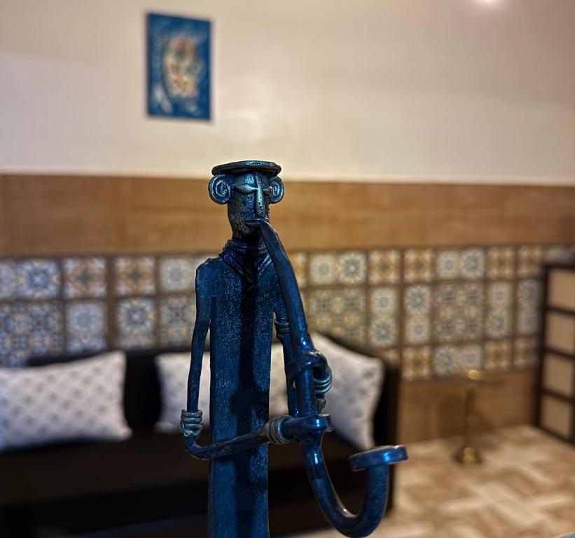 a figurine of a man holding a rope at Villa Palm Desert- your Private Stay with AC, Fast WiFi & Parking in Erfoud