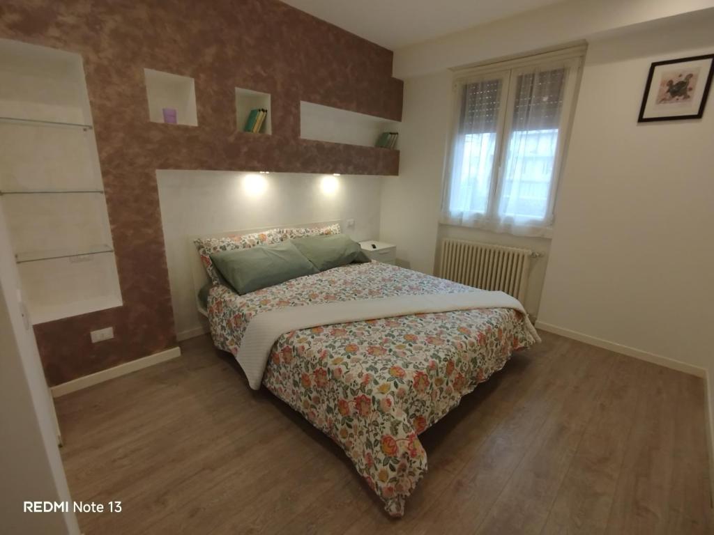 a bedroom with a large bed in a room at La casa dell'orsetta in Loano