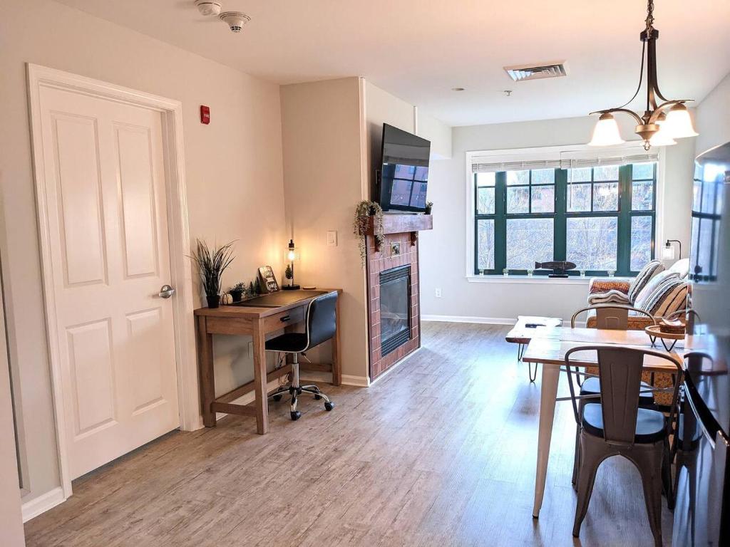 a living room with a desk and a table with a desk at Renovated Chic Premium 1 bdrm in Vernon Township