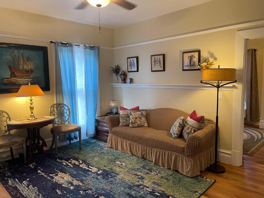 a living room with a couch and a table at Suite in Downtown Riverside in Riverside
