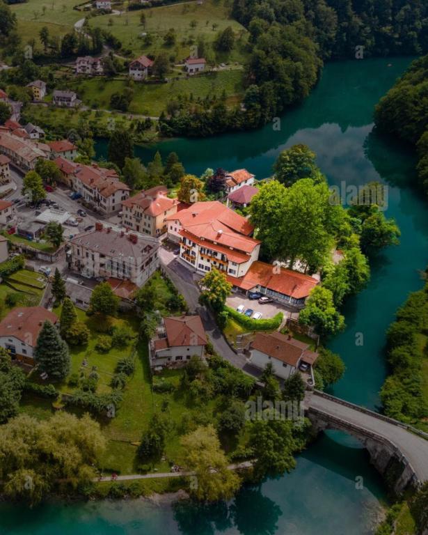 an aerial view of a house on the river at Hotel Lucija in Most na Soči