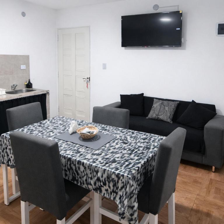a living room with a table and a couch at Departamentos Turísticos Cloe 2 in Fiambalá