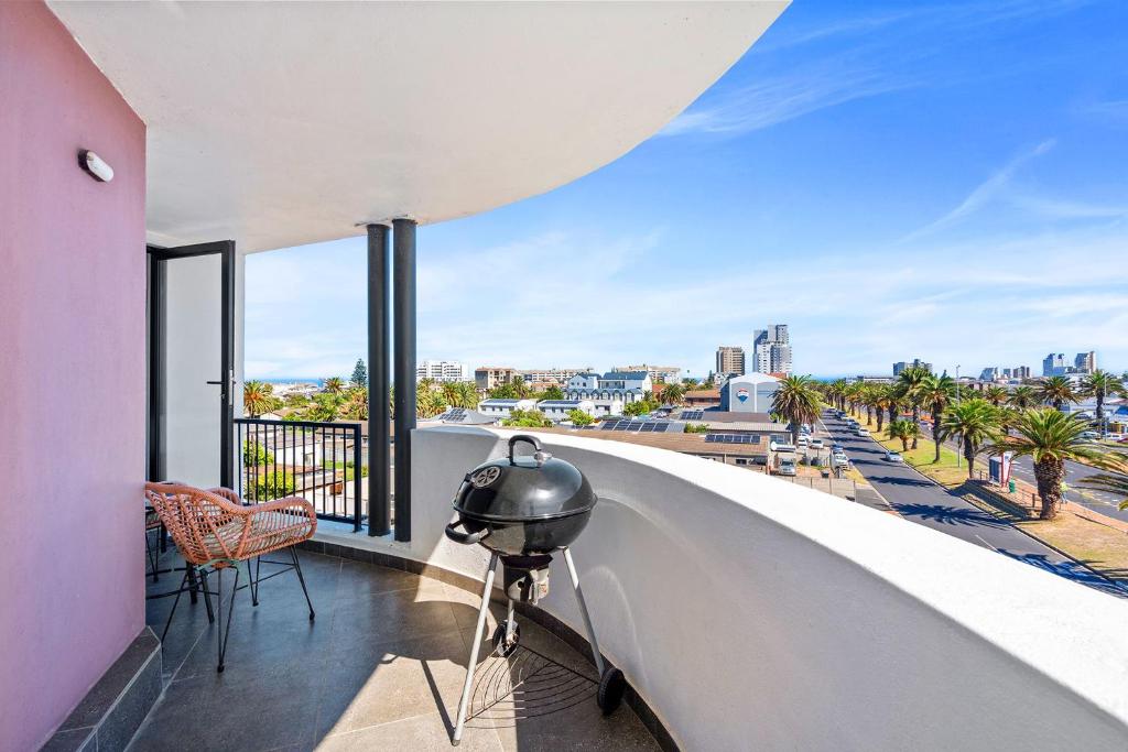 a balcony with a view of a city at Cape on Popham 21B in Bloubergstrand