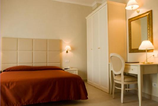 Postel nebo postele na pokoji v ubytování Hotel Gradara