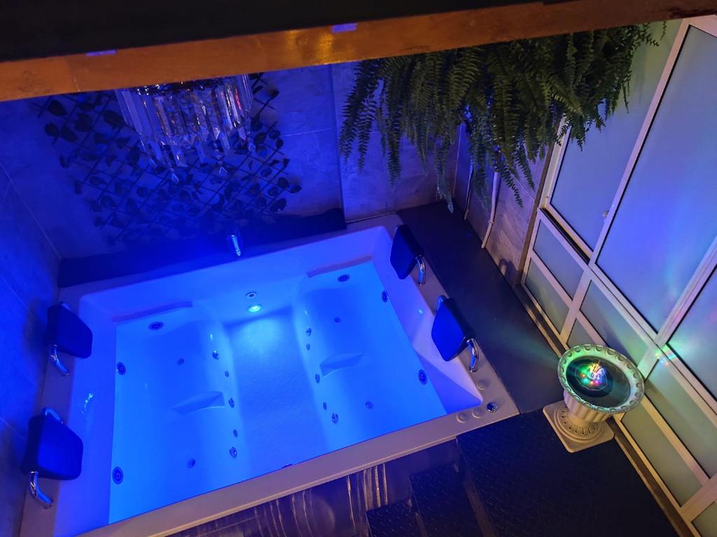 an overhead view of a swimming pool in a room at Magic Garden Luxury Pent-house in Bello