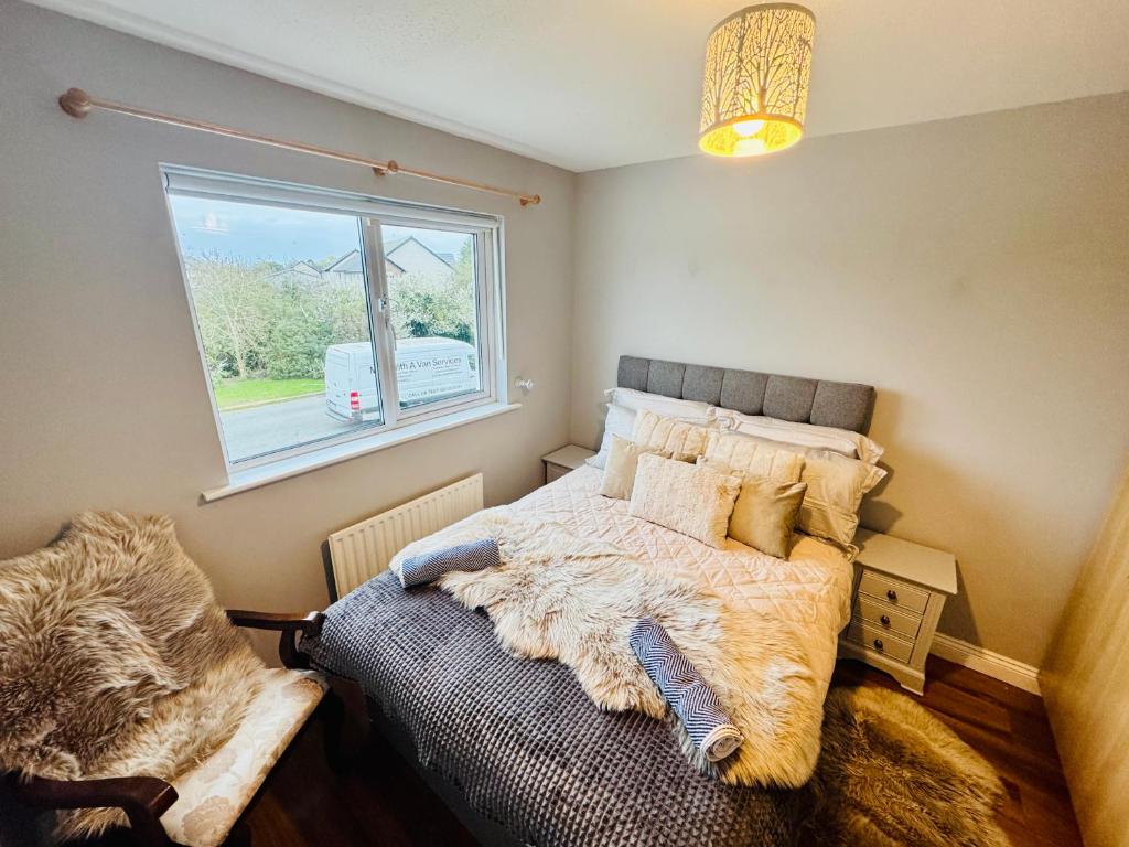 a bedroom with a bed and a window at Duchess Victoria Haven in Drogheda