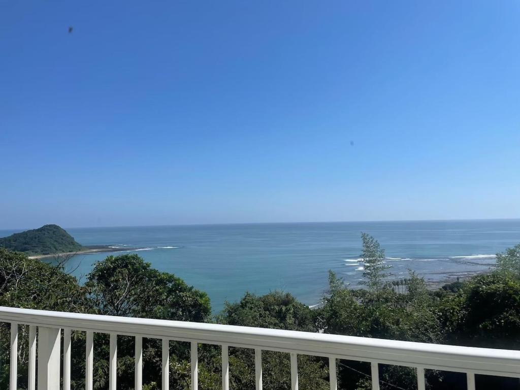a view of the ocean from a balcony at salvia blue in Miyazaki