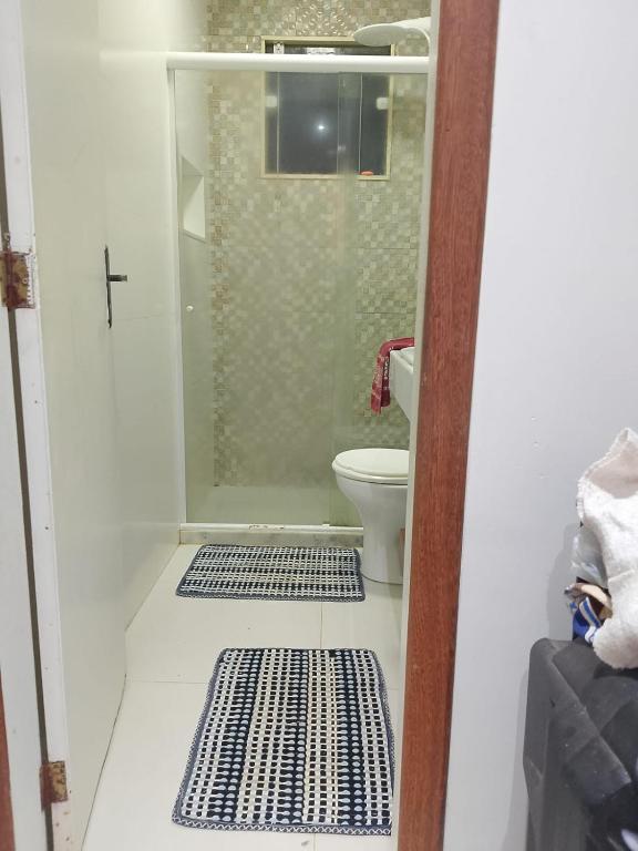 a bathroom with a shower and a toilet at Recanto da gell in Búzios