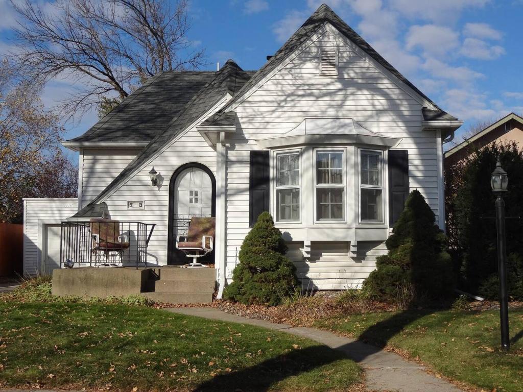 a white house with a window and a porch at 2 Blks St Marys 2 Main Fl Beds Bath CoveredByFaith in Rochester