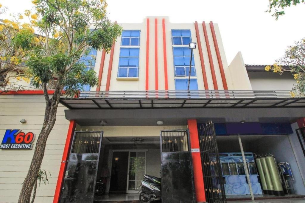a building with a red and white stripes at K Residence Surabaya in Surabaya