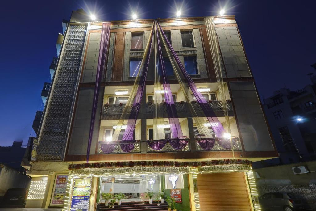 a building with a christmas tree on top of it at Castle Grand Dwarka in New Delhi