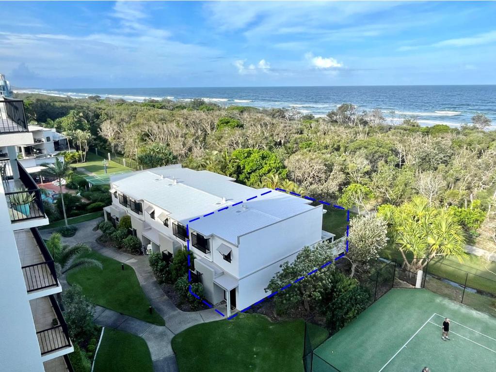 an aerial view of a house and the ocean at Seashells - 3BR Marcoola Beach Resort in Marcoola