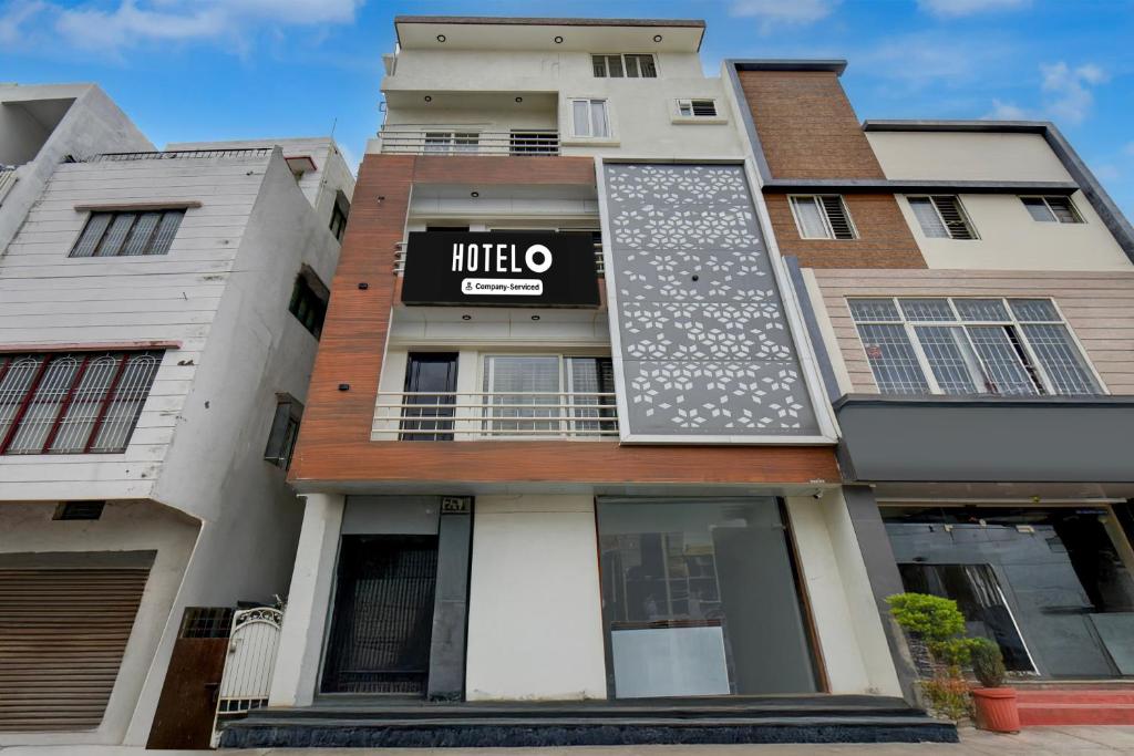 a building with a mitzo sign on it at Super Hotel O Mysore Zoological Park Formerly Queens Comfort in Mysore