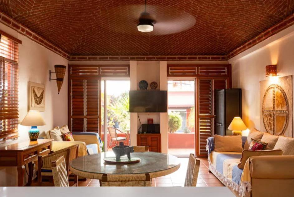 a living room with a couch and a table at Luxury Casa Cindy in Puerto Escondido
