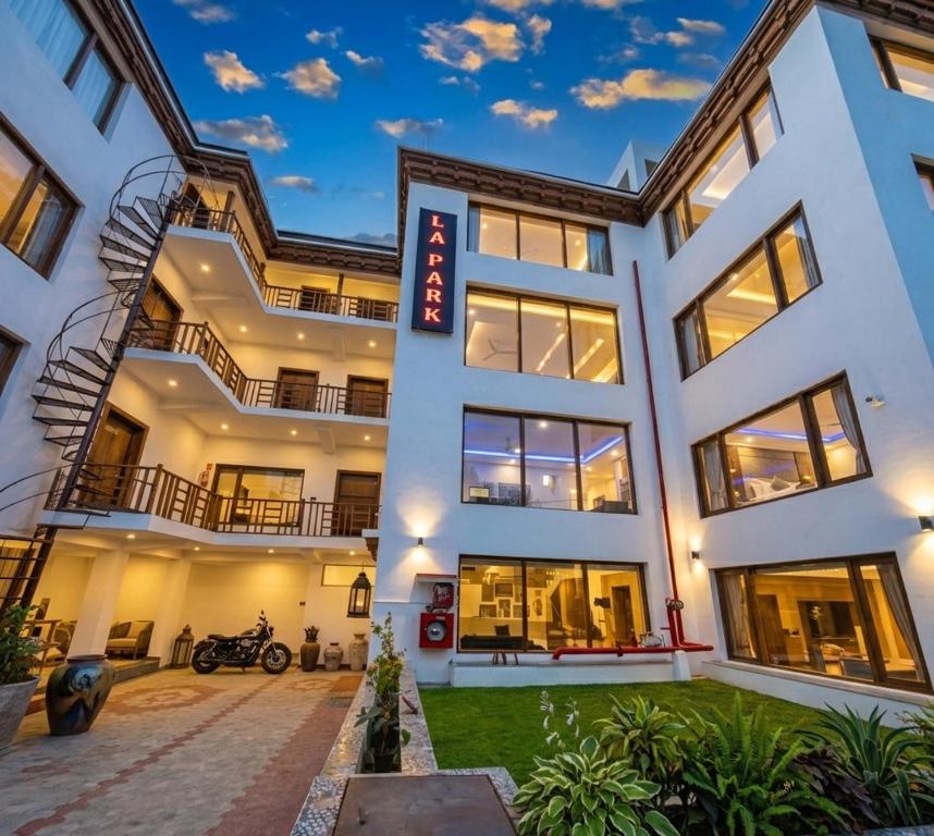 a large white building with a lot of windows at Hotel La Park, Leh in Leh