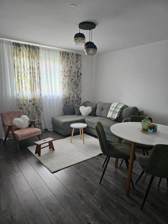 a living room with a couch and a table at Villa Ruscello in Grabovac