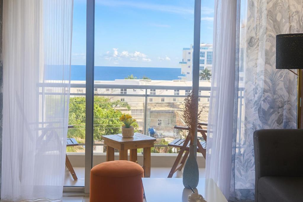 a room with a large window with a view of the ocean at Boca del mar III in Boca Chica