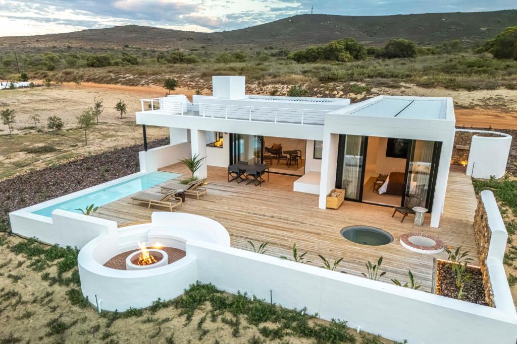 a house in the desert with a deck and a pool at De Wildeveldt in Darling