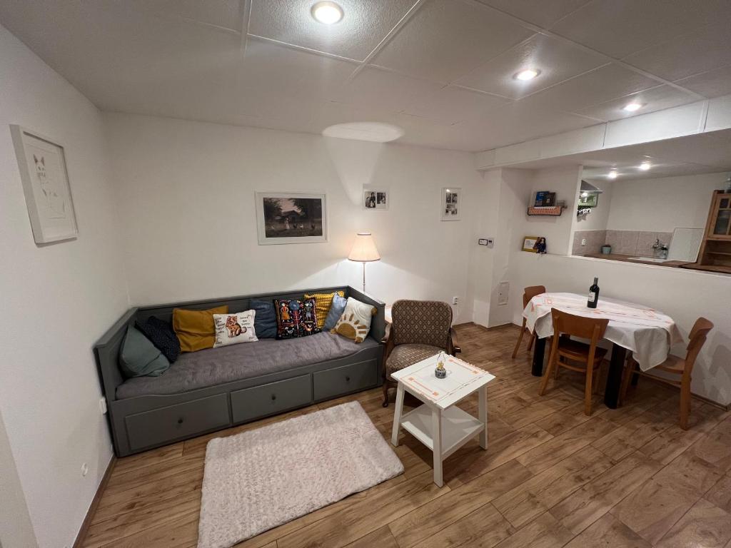 a living room with a couch and a table at U babičky in Suchov
