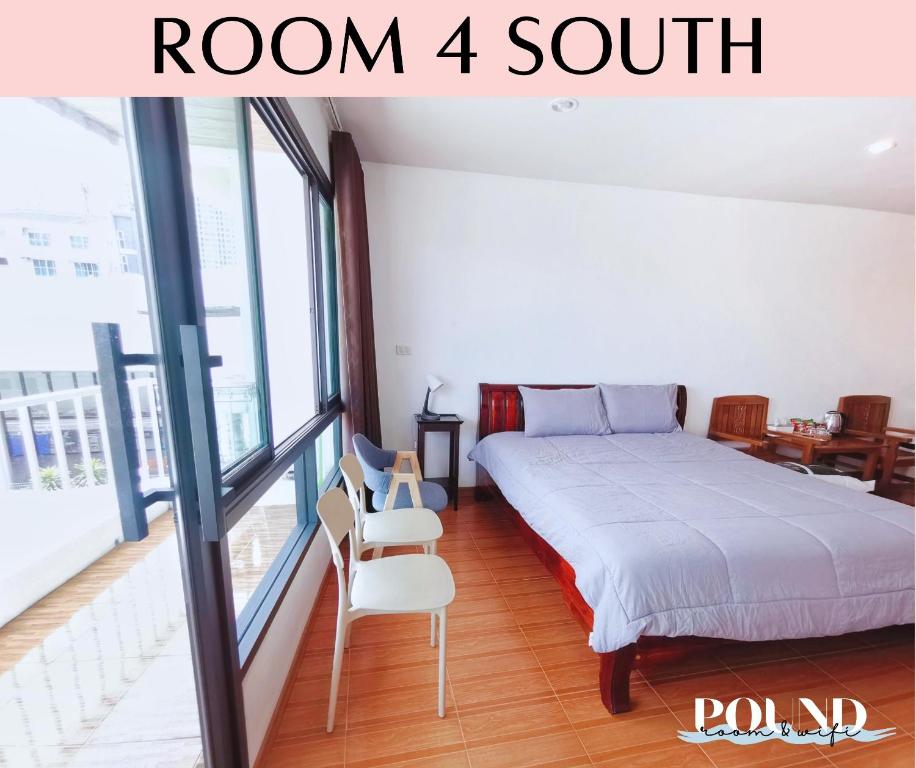 a bedroom with a bed and a room with a balcony at Proud Room &wifi 2 in North Pattaya