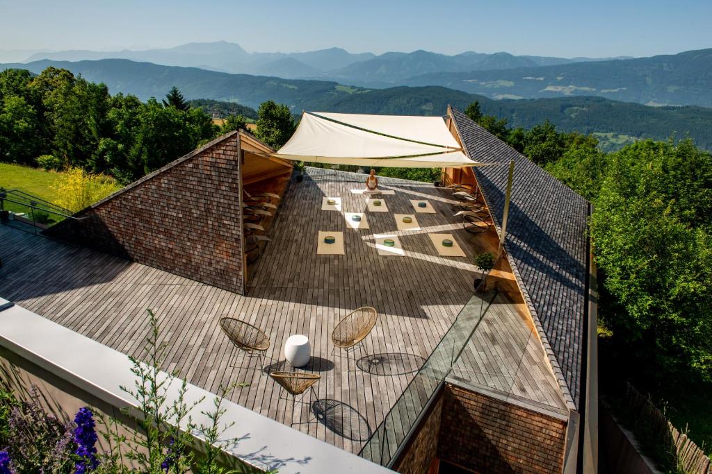 an overhead view of a roof with chairs and a tent at Soami Spaces - Alpine Hideaway in Millstatt