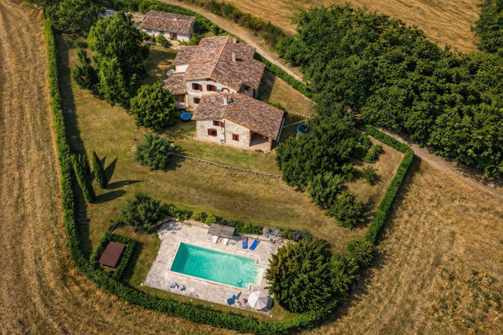 an aerial view of an estate with a swimming pool at Scappo in Umbria, La dolce Godera in Lugnano in Teverina