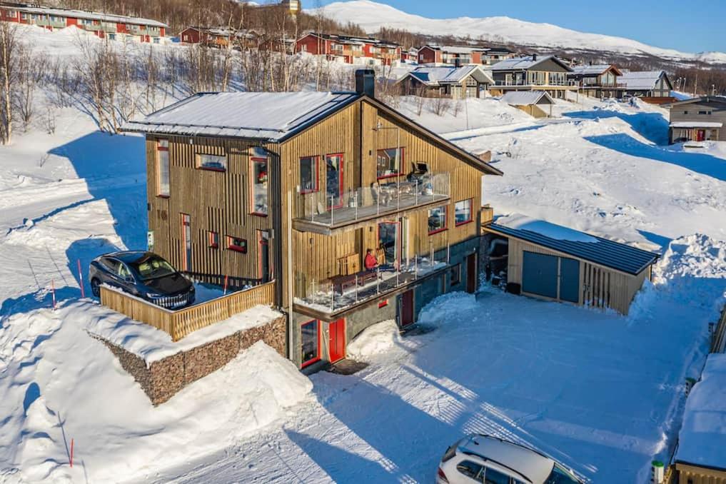 an aerial view of a house in the snow at Hemavan Mountain Lodge Storfjället in Hemavan