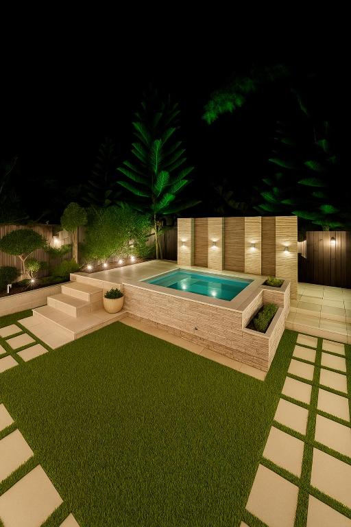 a backyard with a swimming pool at night at Casa Del Cielo in Jarabacoa