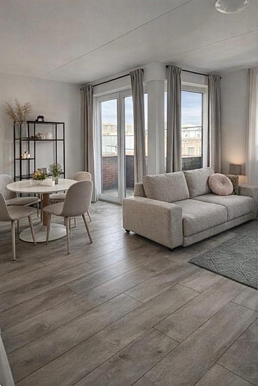 a living room with a couch and a table at The Residence Enschede in Enschede