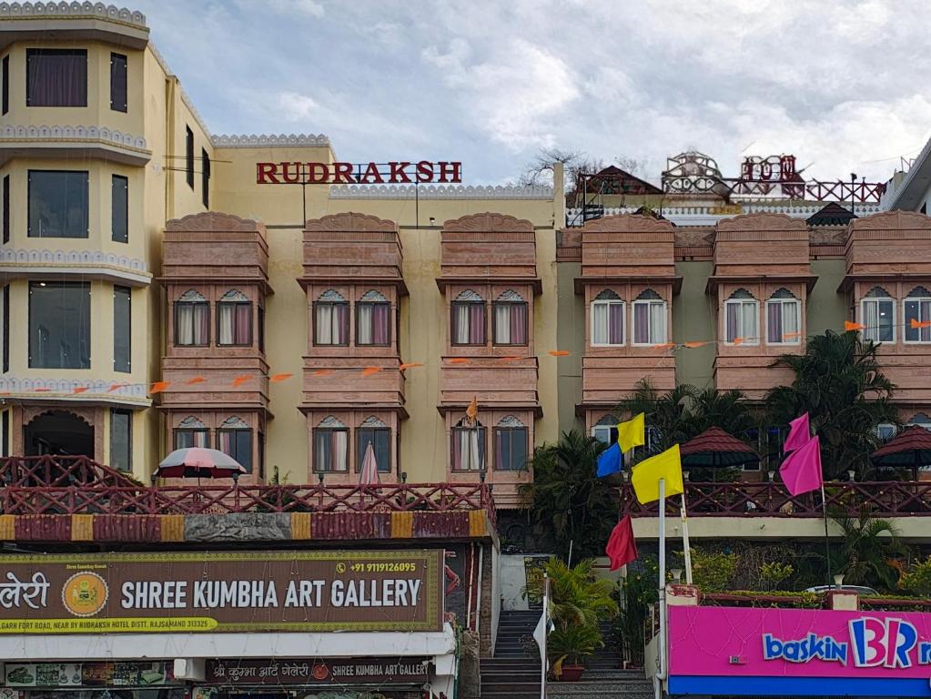 a large building with a sign in front of it at RUDRAKSH HOTEL & RESTAURANT in Kumbhalgarh in Kumbhalgarh