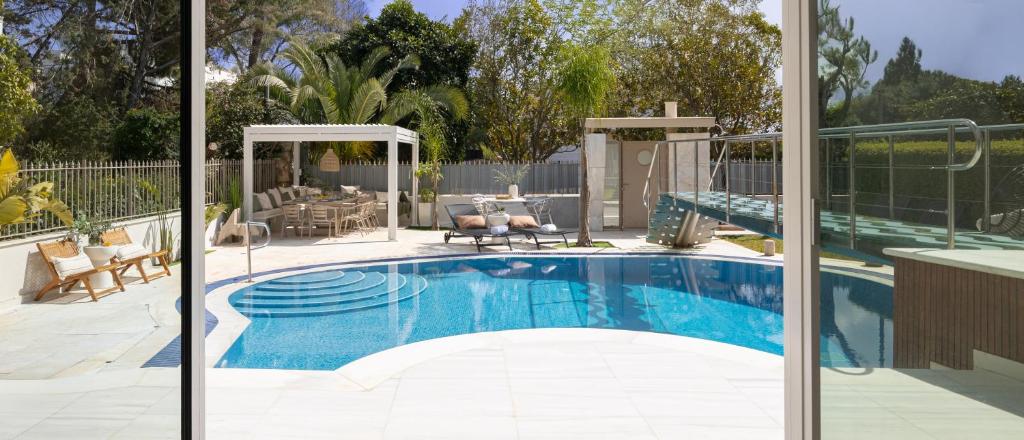 a swimming pool in a house with a patio at Villa Stefani with Private Pool in Athens