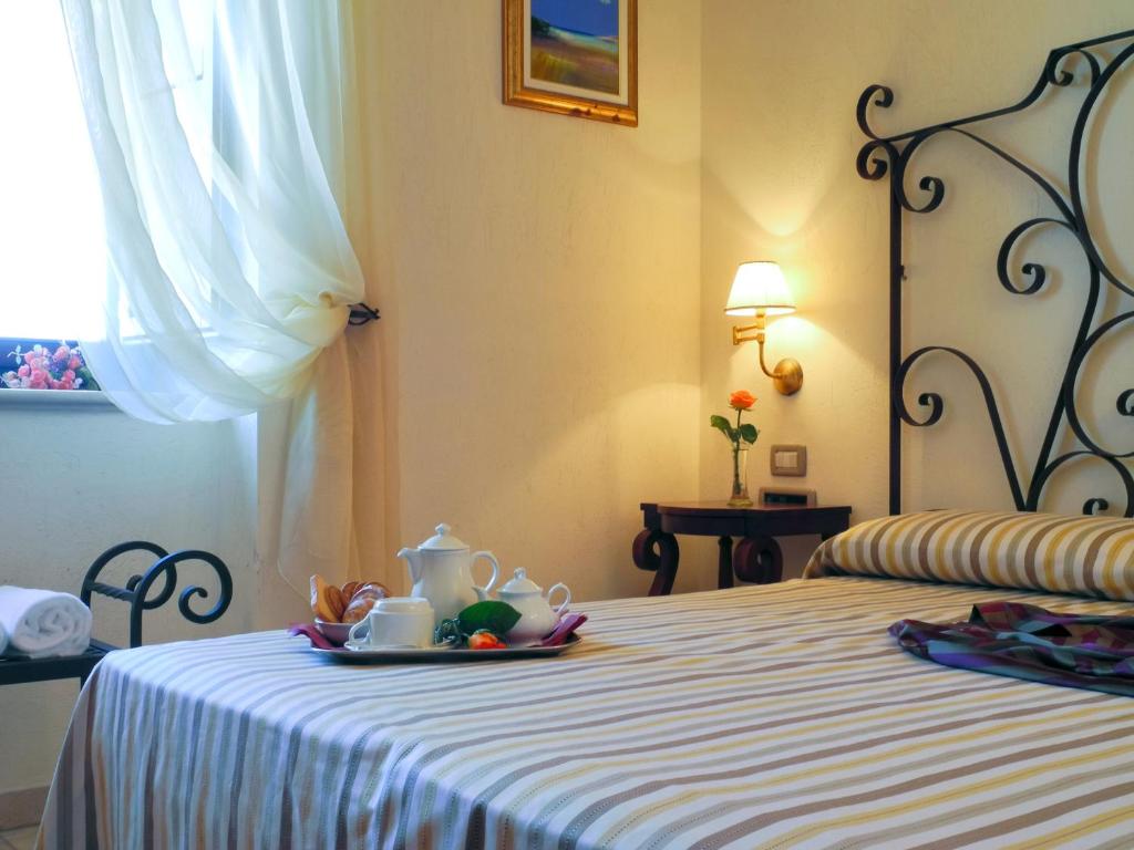 Łóżko lub łóżka w pokoju w obiekcie Relais Sant'Eligio