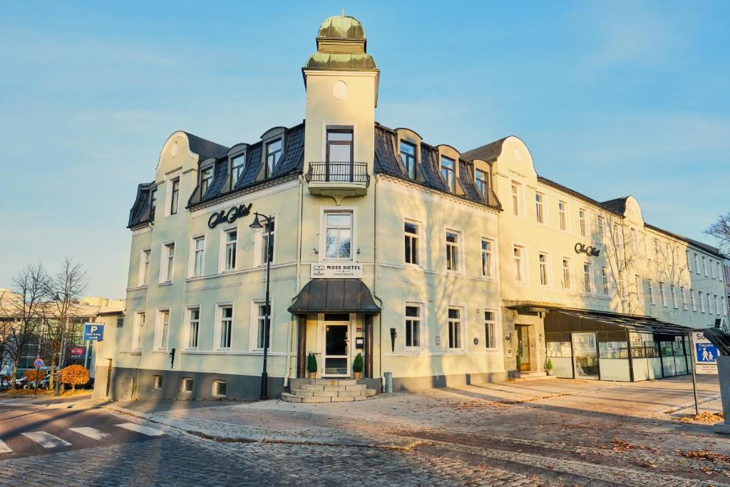 a building with a clock tower on top of it at Moss Hotel & Apartments in Moss