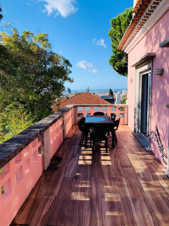 a table on the balcony of a house at Gama House Shared Appartment in Lisbon